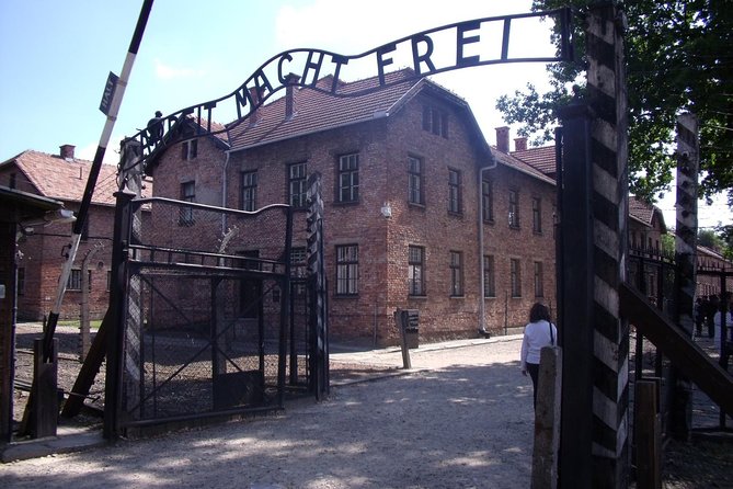 1 Day Trip Auschwitz-Birkenau Memorial and Museum Guided Tour from Krakow - Entering Auschwitz I and beginning the guided visit