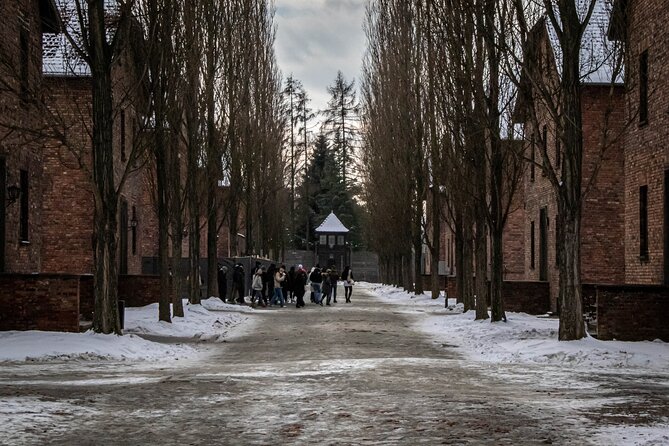 Auschwitz Birkenau Tour from Krakow: Private Transfer + Ticket - Auschwitz I and the gate with its chilling inscription