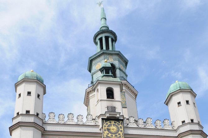 Discover Poznan: Walk, Take a tram and have a traditional snack - Starting beneath the Town Hall and its famous goats