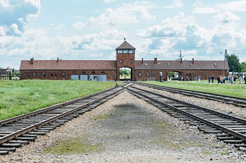 From Krakow: Auschwitz-Birkenau Guided Tour & Hotel Pickup - Auschwitz I and the Arbeit Macht Frei gate