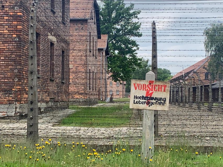 From Krakow: Guided Auschwitz-Birkenau Group Tour by Minivan - Auschwitz I and the Arbeit Macht Frei gate