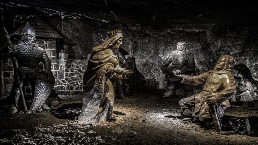 From Krakow: Wieliczka Salt Mine Guided Tour & Transfer - Salt extraction, sculpture, and the human side of the mine