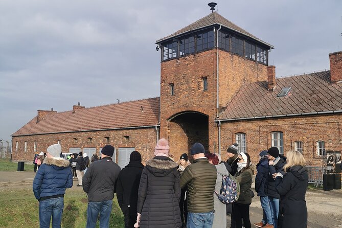 Guided Tour from Krakow to Auschwitz Birkenau with hotel pick up - Birkenau: Scale, railway tracks, and open ground