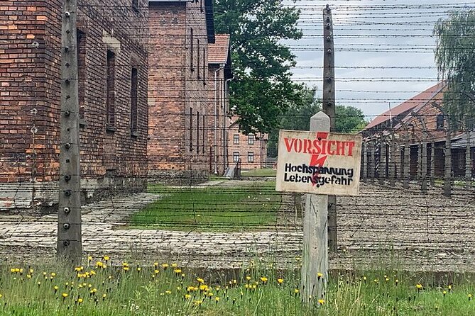 Krakow: Auschwitz-Birkenau Guided Tour & Hotel Pick Up - Auschwitz I: exhibitions and the Arbeit Macht Frei gate