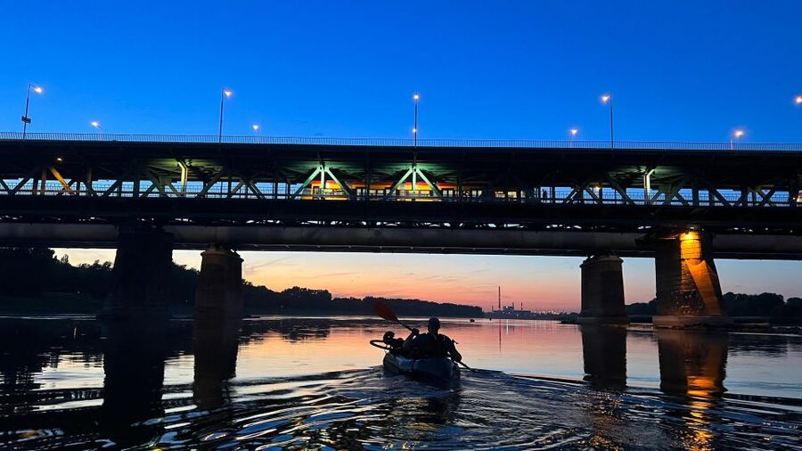 Packrafting kayaking guided tour Vistula river Warsaw Poland - The sunset view toward the Old Town