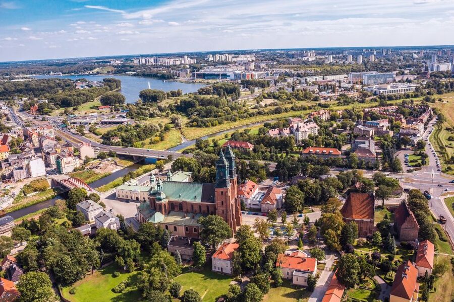 Poznan: Old Town, Srodka District, & Cathedral Private Tour - Crossing Chrobry Bridge toward the Old Town